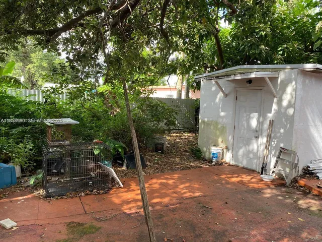 a backyard of a house with lots of green space