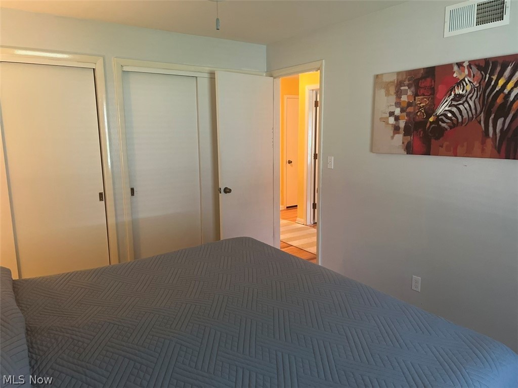 759 Truesdale Road Youngstown, OH 44511 - Photo 15 of 37 Bedroom with two closet and hardwood / wood-style floors