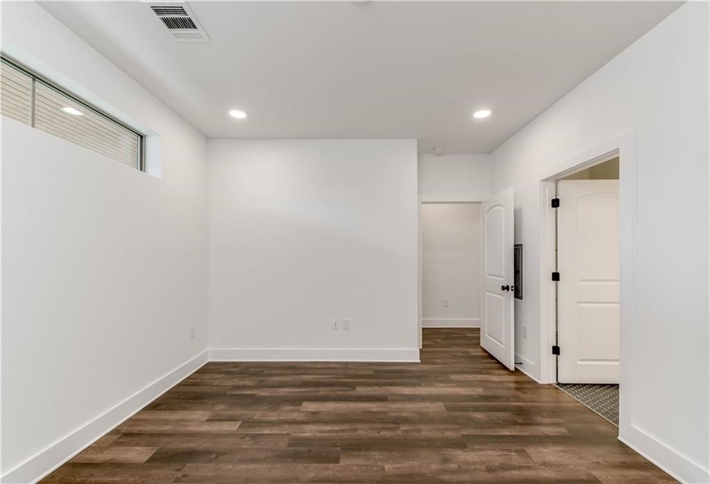4704 Sunset Trail, Unit 3102 Austin, TX 78745 - Photo 15 of 40 a view of empty room with wooden floor