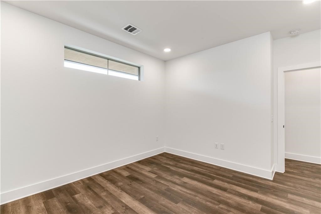 4704 Sunset Trail, Unit 3102 Austin, TX 78745 - Photo 16 of 40 a view of empty room with wooden floor