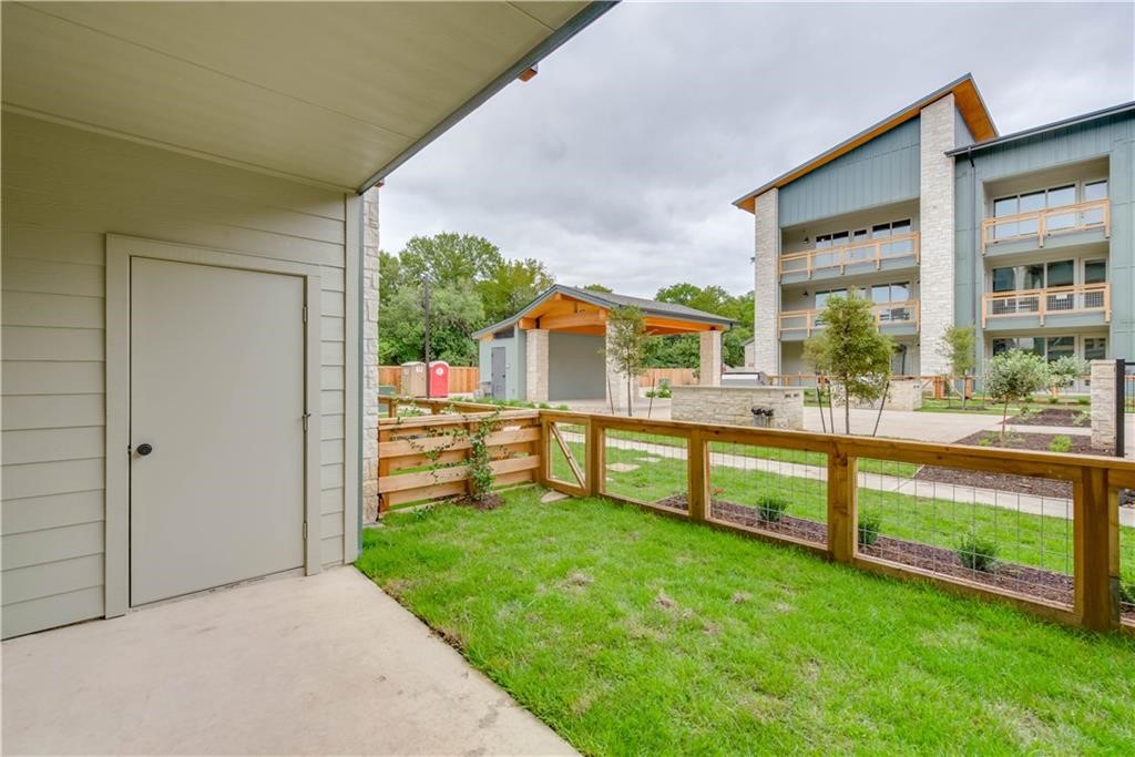 4704 Sunset Trail, Unit 3102 Austin, TX 78745 - Photo 25 of 40 a view of house with a big yard potted plants and large tree