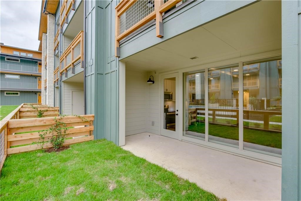 4704 Sunset Trail, Unit 3102 Austin, TX 78745 - Photo 27 of 40 a view of a house with a backyard
