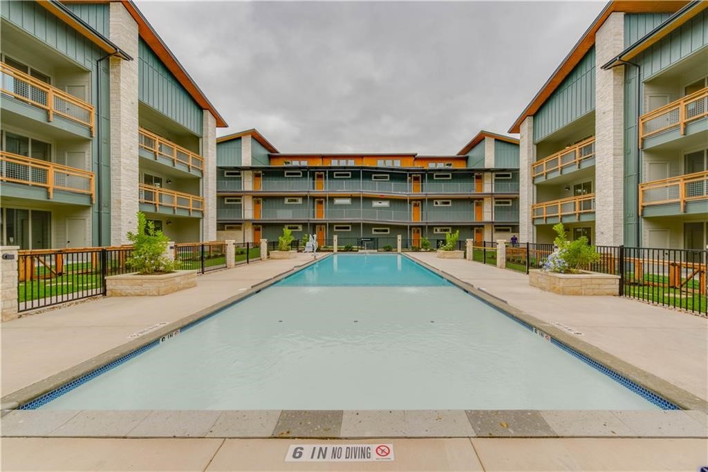 4704 Sunset Trail, Unit 3102 Austin, TX 78745 - Photo 30 of 40 a view of swimming pool with building exterior