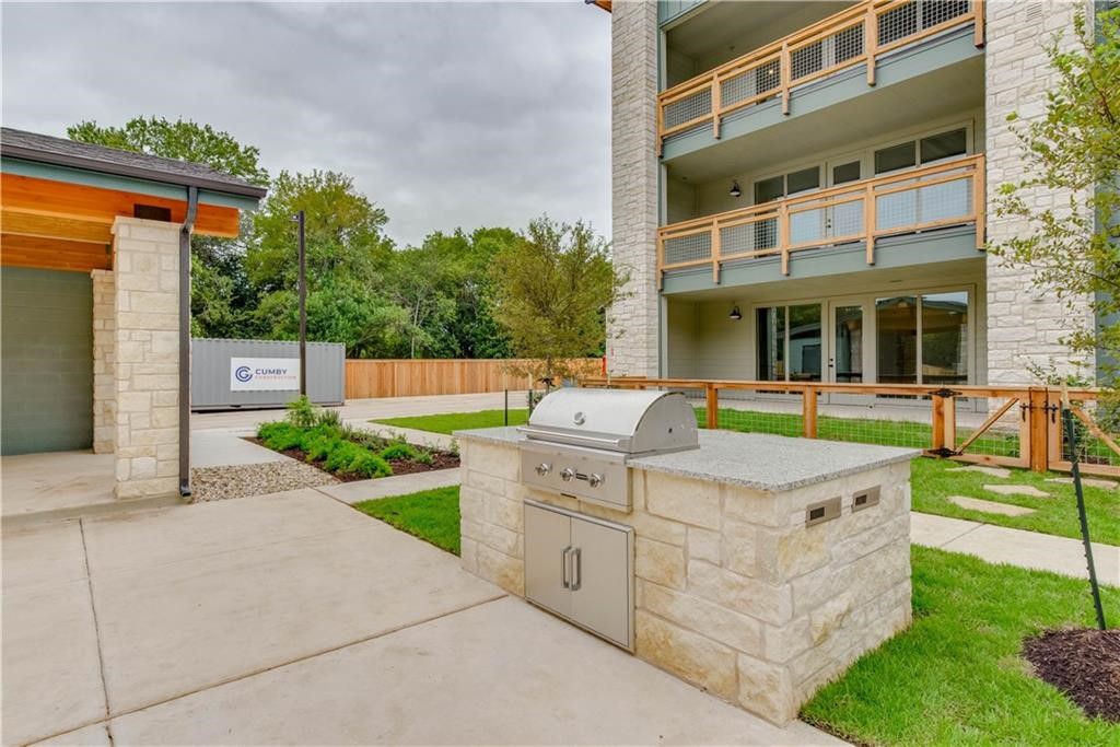 4704 Sunset Trail, Unit 3102 Austin, TX 78745 - Photo 33 of 40 a front view of a building with garden and trees