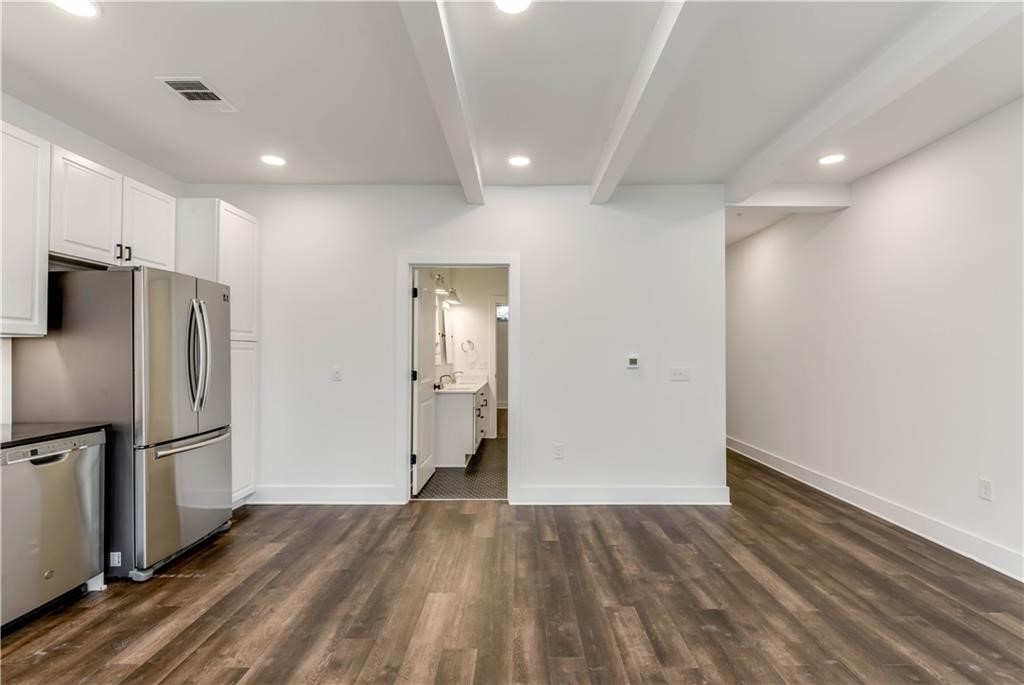 4704 Sunset Trail, Unit 3102 Austin, TX 78745 - Photo 9 of 40 a view of empty room with wooden floor