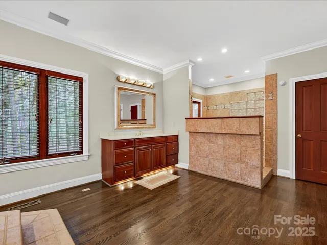 a view of a door with a window and wooden floor