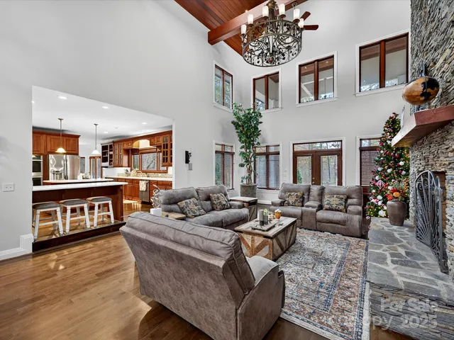 a living room with fireplace furniture and a wooden floor