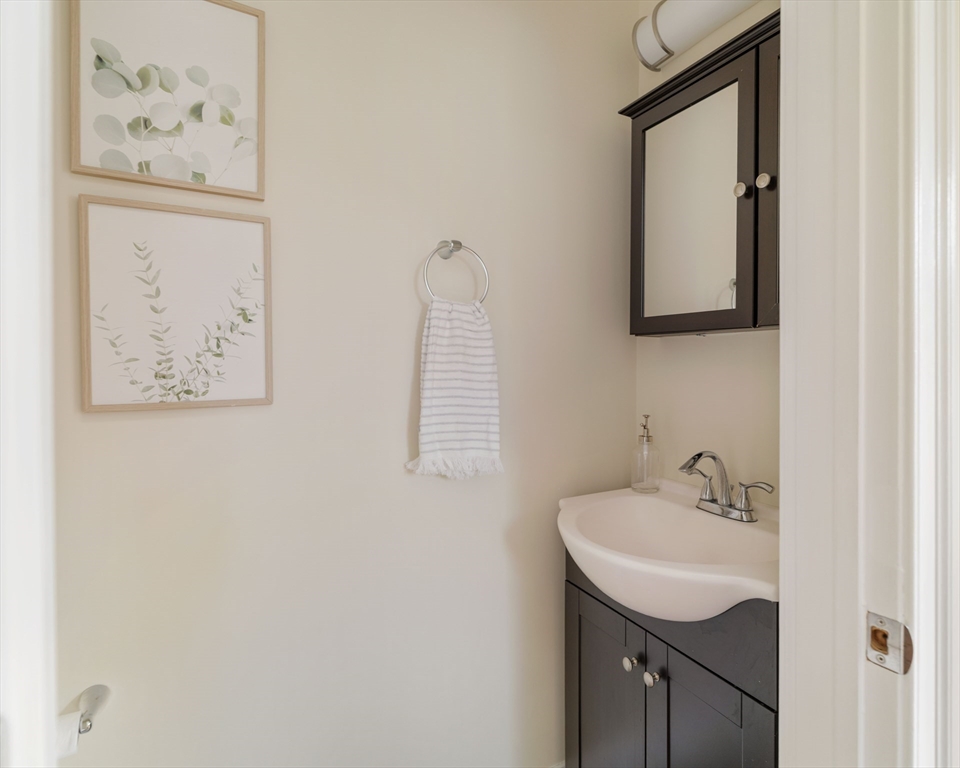 16 Partridge Avenue Somerville, MA 02145 - Photo 15 of 32 a bathroom with a sink and a mirror