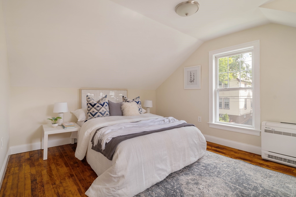 16 Partridge Avenue Somerville, MA 02145 - Photo 16 of 32 a bedroom with a bed and a window
