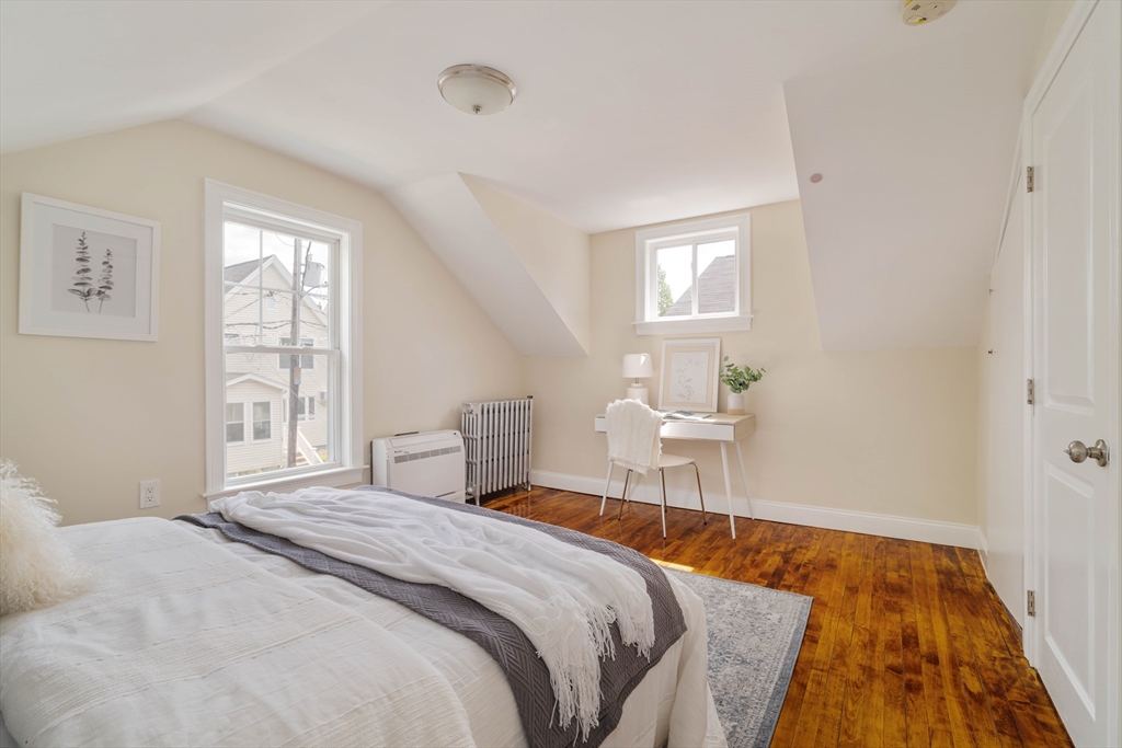16 Partridge Avenue Somerville, MA 02145 - Photo 18 of 32 a bedroom with a bed and a window