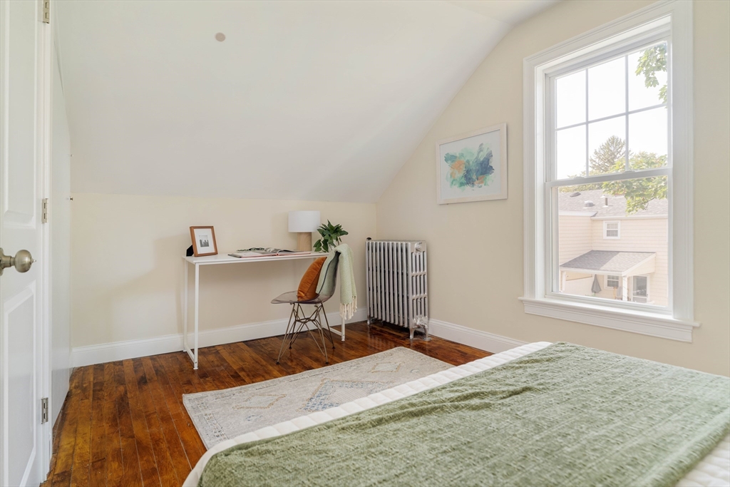 16 Partridge Avenue Somerville, MA 02145 - Photo 23 of 32 a bedroom with a bed and a window