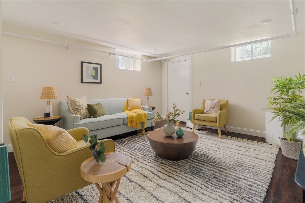 16 Partridge Avenue Somerville, MA 02145 - Photo 26 of 32 a living room with furniture and a potted plant