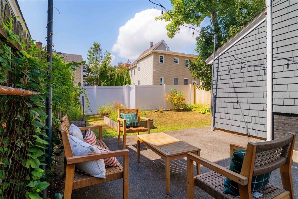 16 Partridge Avenue Somerville, MA 02145 - Photo 28 of 32 a view of a patio with table and chairs and potted plants