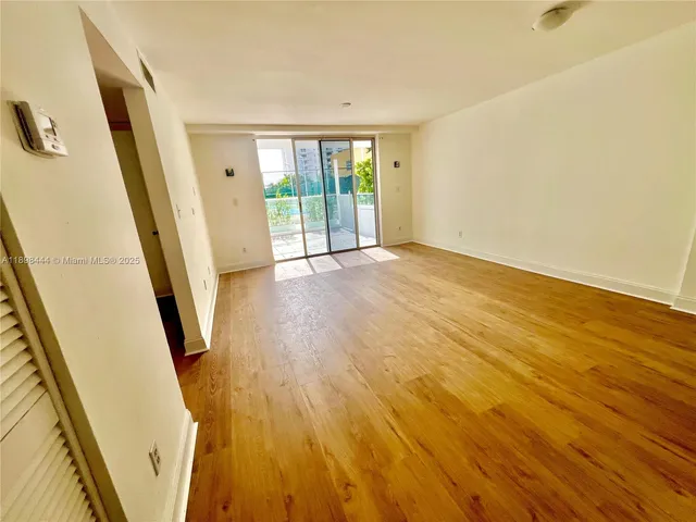 a kitchen with granite countertop a sink stainless steel appliances and cabinets