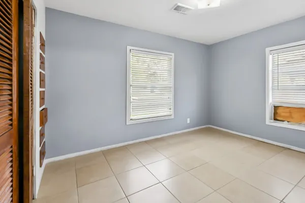 a view of an empty room with a window