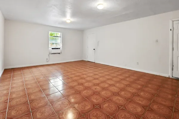a view of an empty room with a window