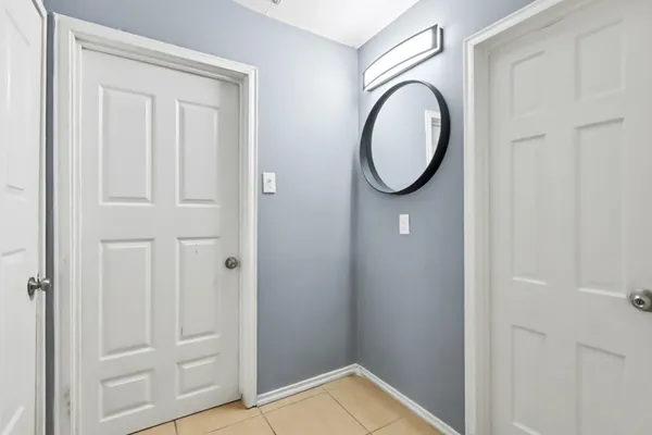 a bathroom with a granite countertop toilet and a sink