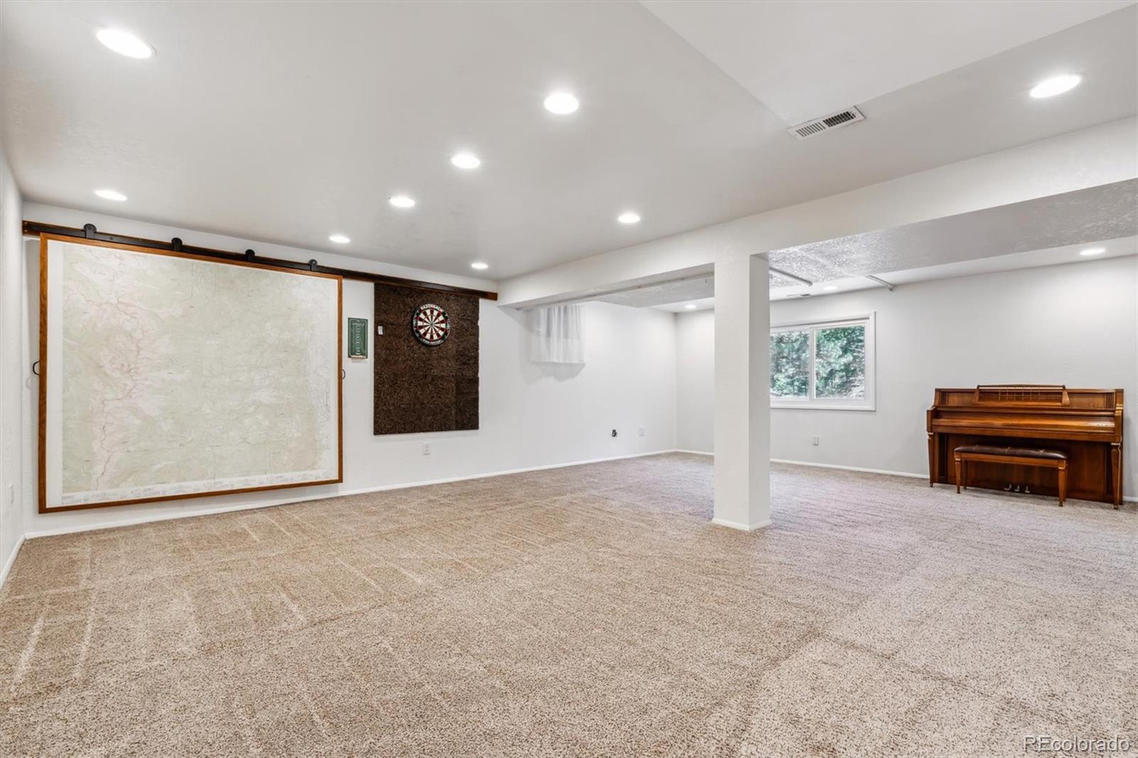 94 Spring Lane Boulder, CO 80302 - Photo 24 of 47 a view of empty room with wooden floor and furniture