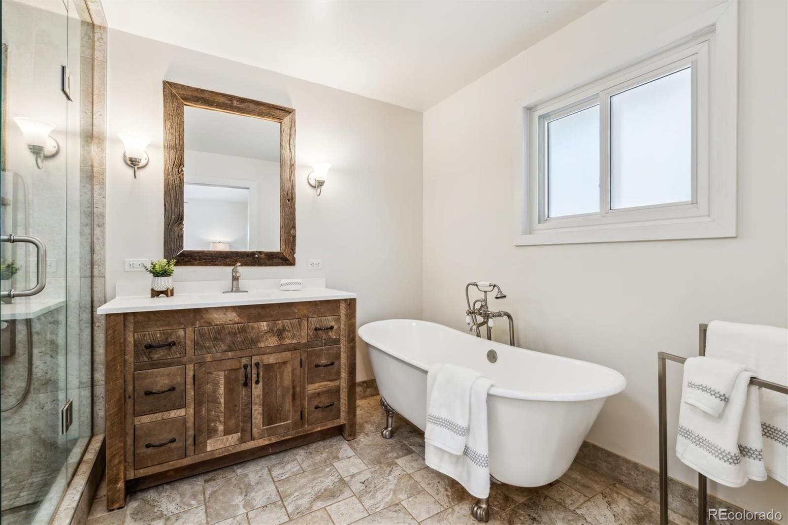 94 Spring Lane Boulder, CO 80302 - Photo 4 of 47 a bathroom with a double vanity sink mirror and bathtub