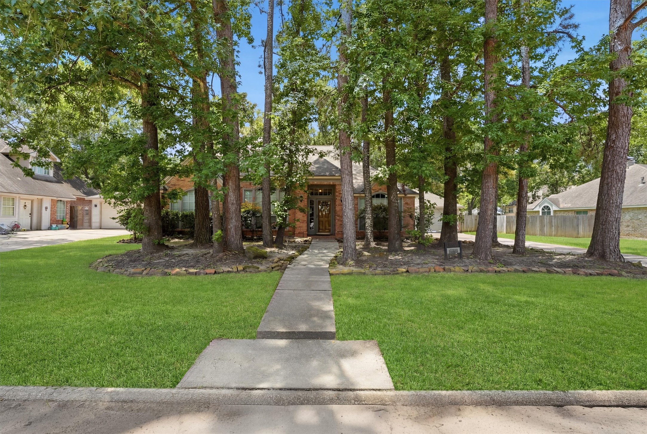 Beautiful trees give privacy to the home.