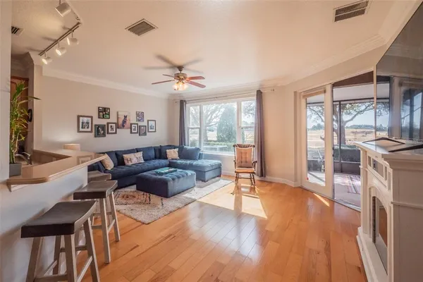 a kitchen with granite countertop a table chairs stove a sink and dishwasher