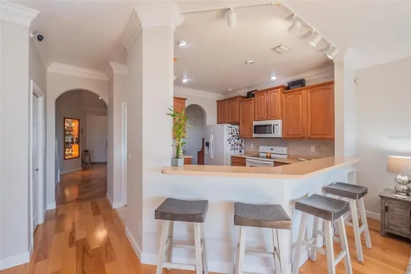a kitchen with a sink stove and cabinets