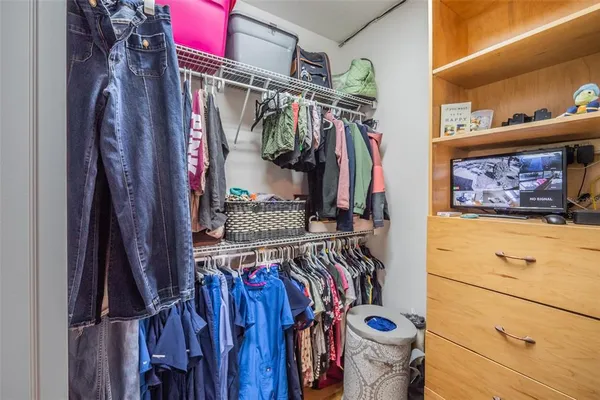 a bathroom with a sink a mirror and a shower