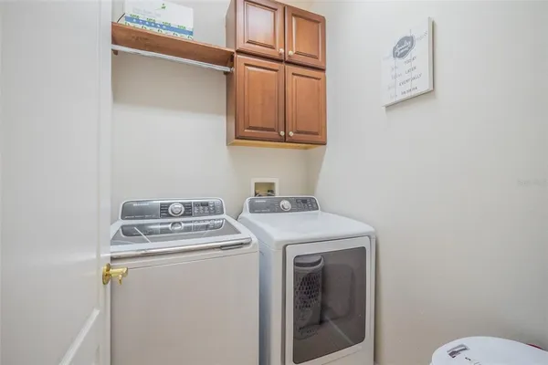 a view of room with window and wooden floor