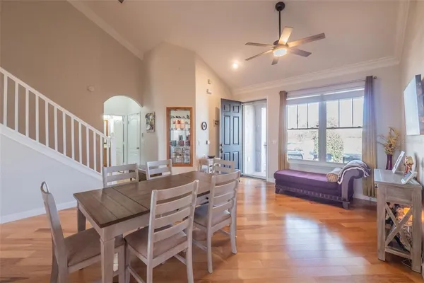 a view of a dining room with furniture and wooden floor