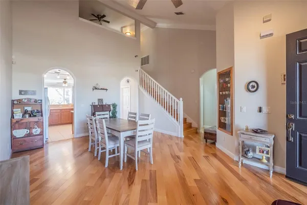 a view of a dining room with furniture and wooden floor