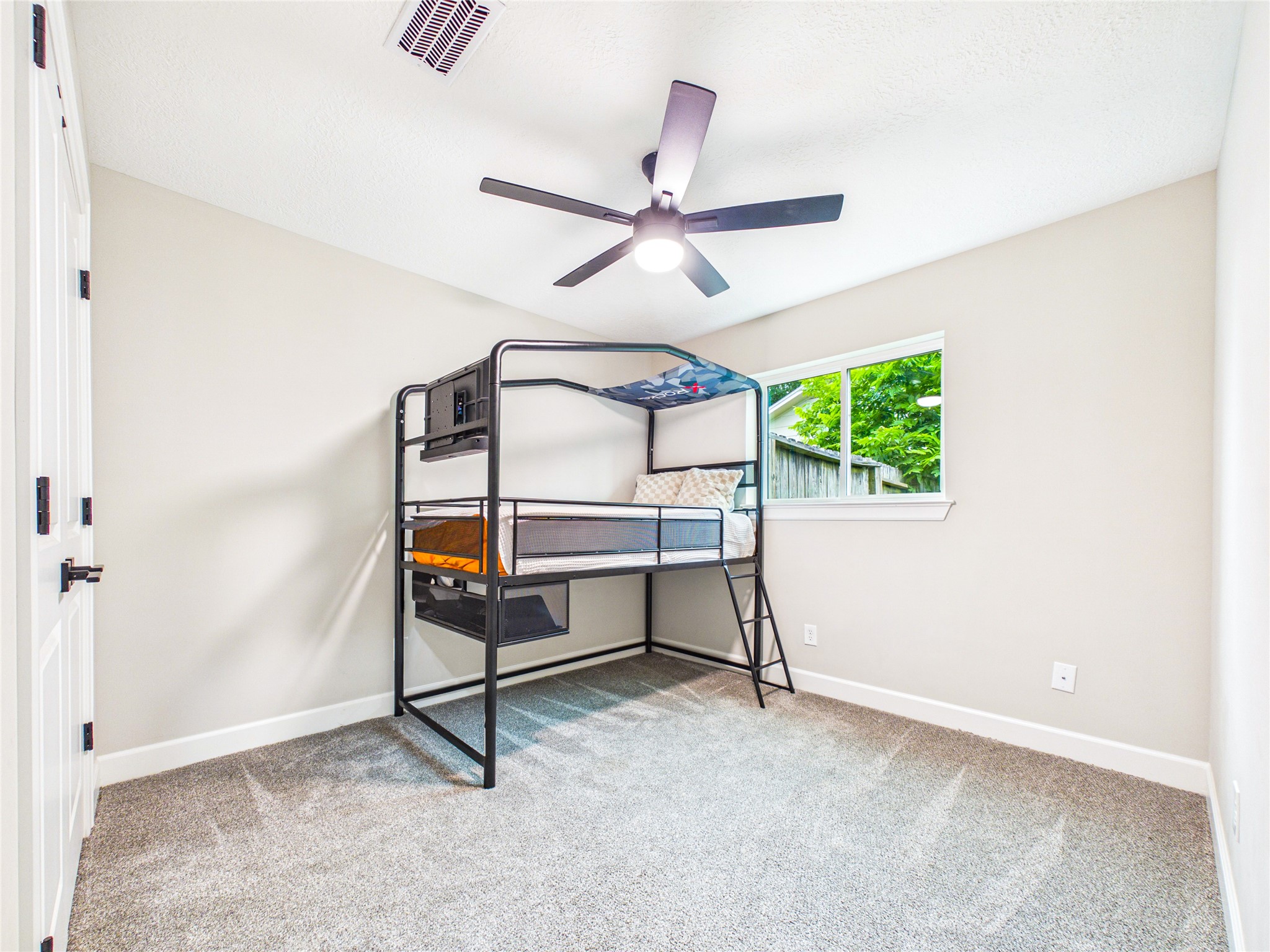 10306 Rustic Rock Road La Porte, TX 77571 - Photo 21 of 38 a bedroom with ceiling fan and window