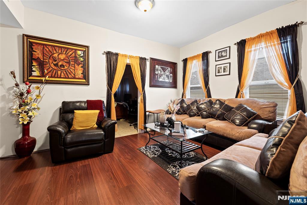 436 Ellison Street Paterson, NJ 07501 - Photo 20 of 47 a living room with furniture and wooden floor