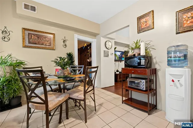 a bedroom with a bed and a chair