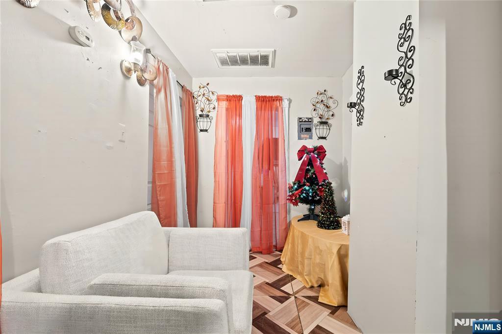 436 Ellison Street Paterson, NJ 07501 - Photo 28 of 47 a living room with furniture and a window