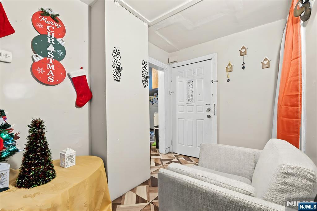 436 Ellison Street Paterson, NJ 07501 - Photo 29 of 47 a living room with furniture and a window