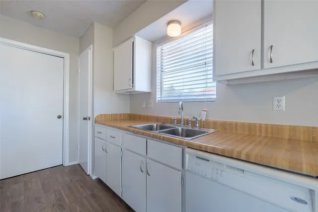 a kitchen with a sink and cabinets