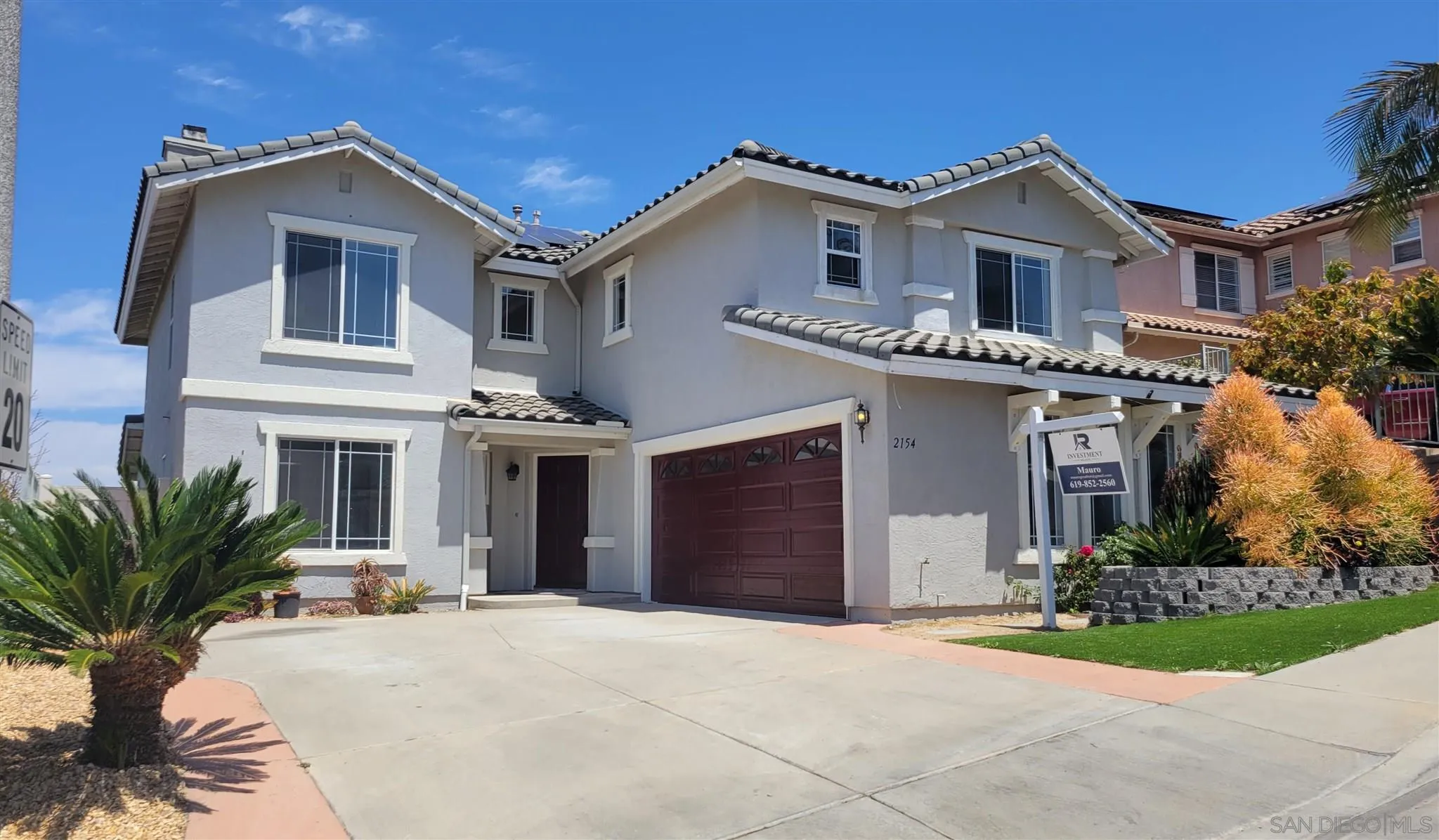 2154 Crystal Clear Drive Spring Valley, CA 91978 - Photo 1 of 5 a front view of a house with a yard and garage