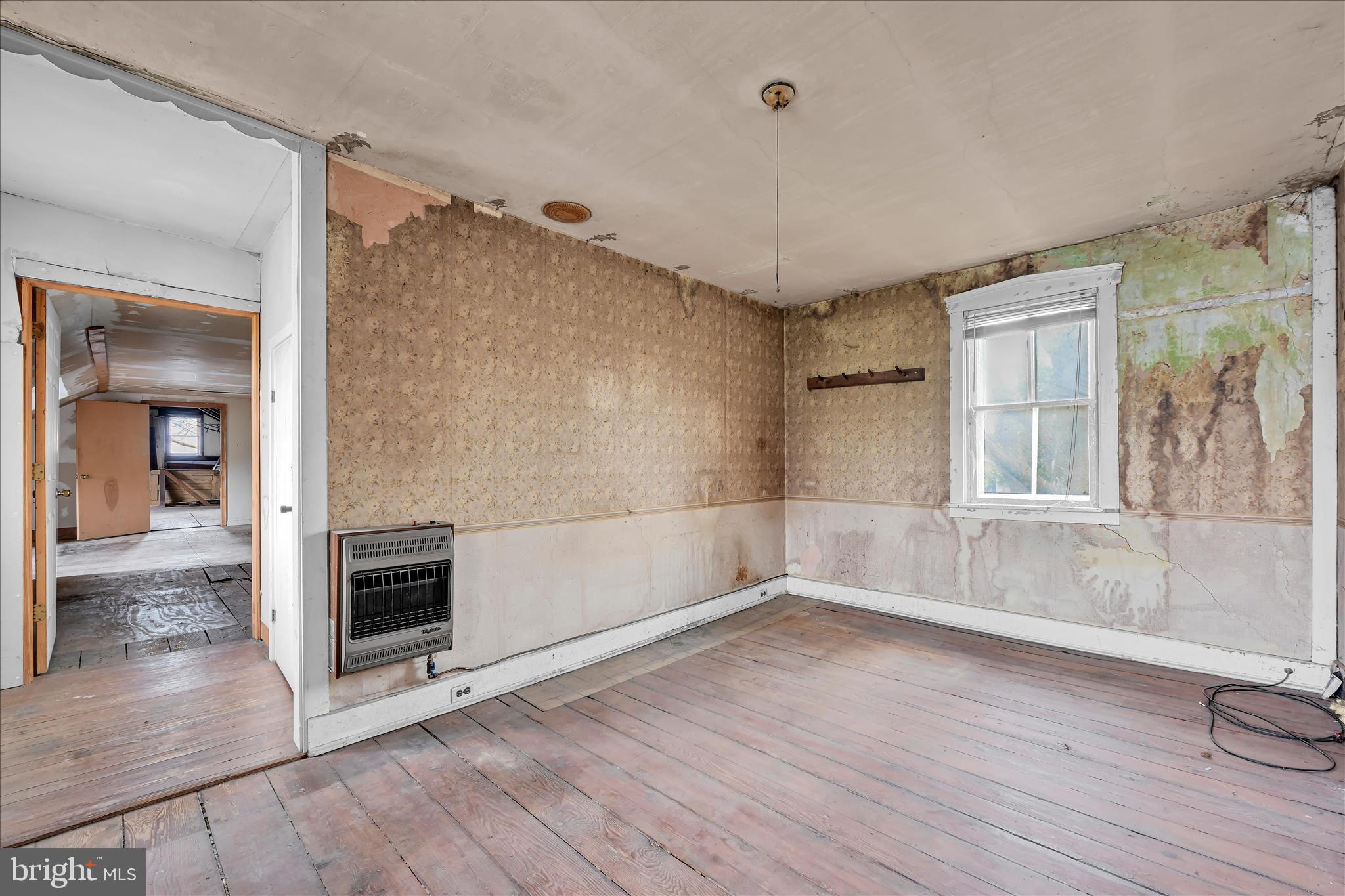854 Centerville Road Lancaster, PA 17601 - Photo 19 of 39 a view of an empty room with a window and wooden floor