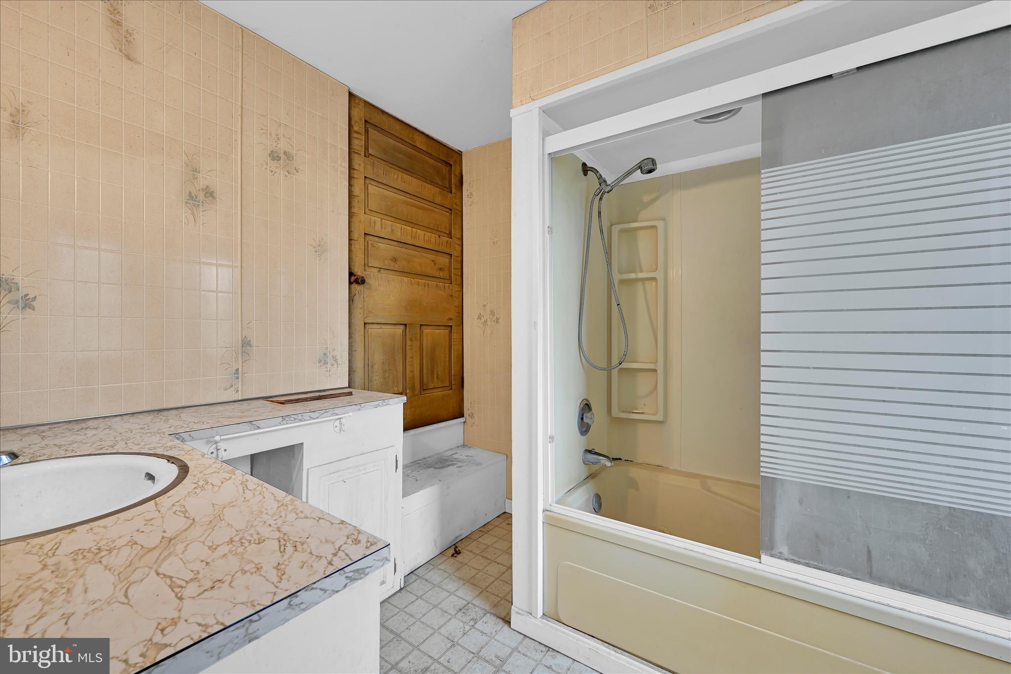854 Centerville Road Lancaster, PA 17601 - Photo 21 of 39 a bathroom with a granite countertop sink and a bathtub