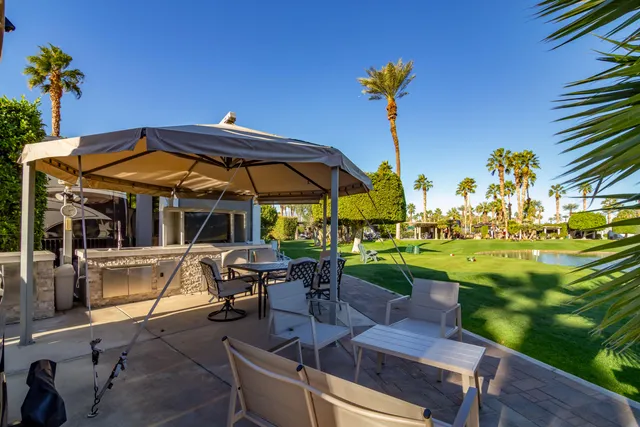a view of a backyard with a patio