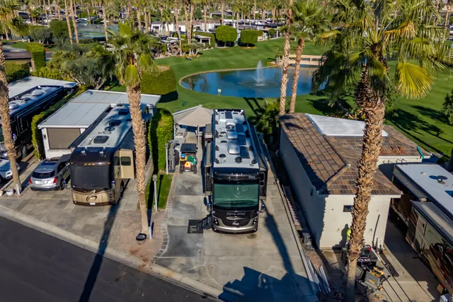 an aerial view of multiple houses with yard