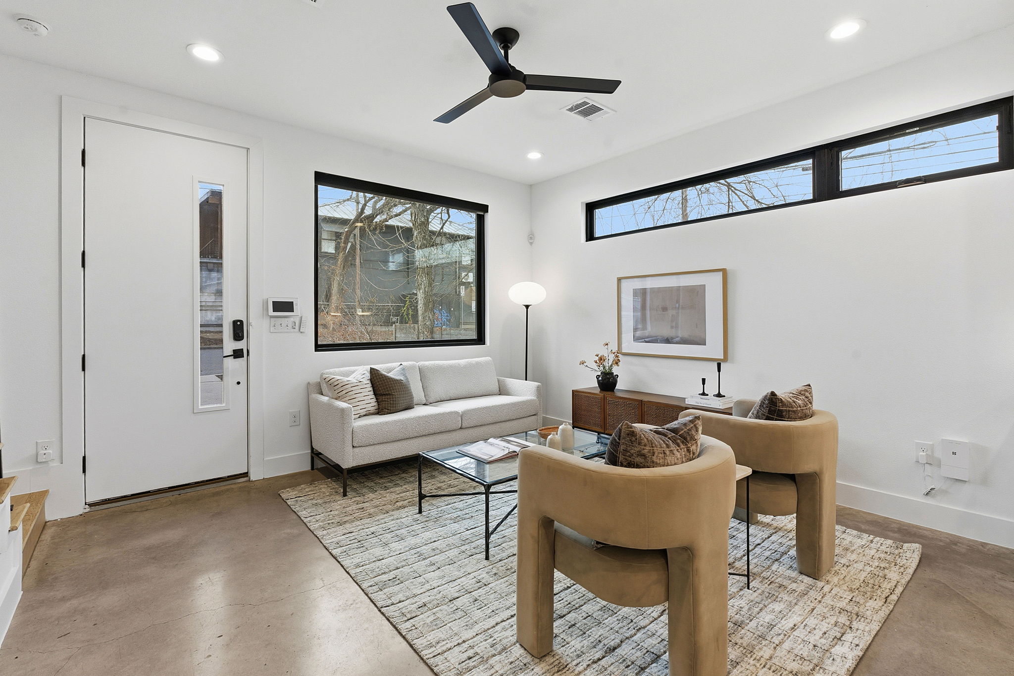 2411 Santa Rosa Street, Unit A Austin, TX 78702 - Photo 12 of 24 Living area featuring finished concrete flooring, ceiling fan, and recessed lighting