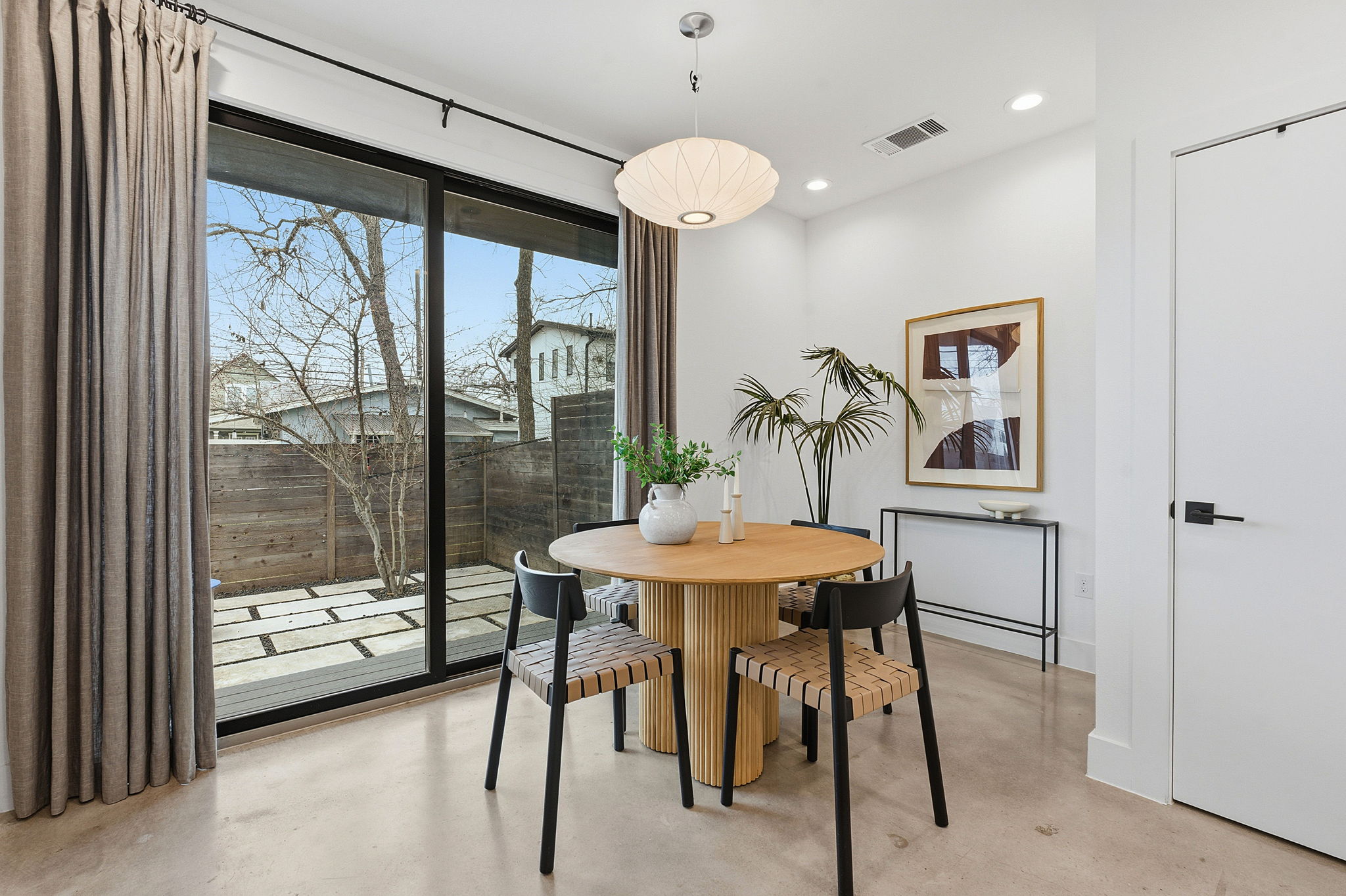 2411 Santa Rosa Street, Unit A Austin, TX 78702 - Photo 5 of 24 Dining room with concrete floors and recessed lighting