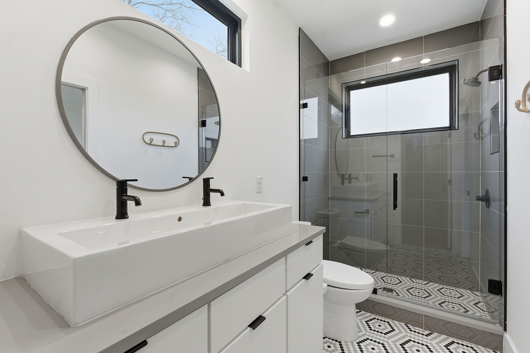 2411 Santa Rosa Street, Unit A Austin, TX 78702 - Photo 7 of 24 Bathroom featuring double vanity, a shower stall, and light tile patterned floors