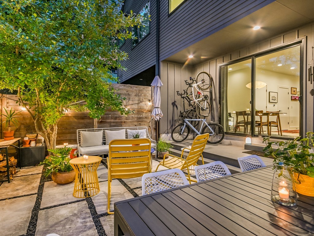 2411 Santa Rosa Street, Unit A Austin, TX 78702 - Photo 9 of 24 Fenced backyard with an outdoor living space, outdoor dining space, and a patio area