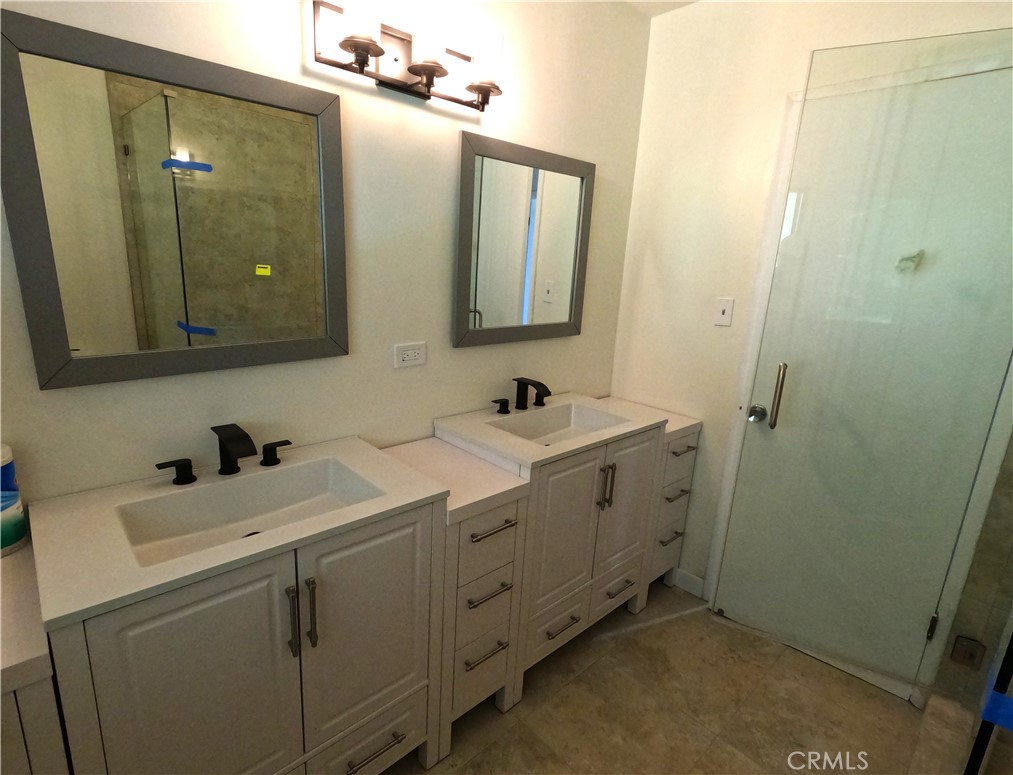 1515 Belleau Road Glendale, CA 91206 - Photo 17 of 35 a bathroom with a double vanity sink and mirror