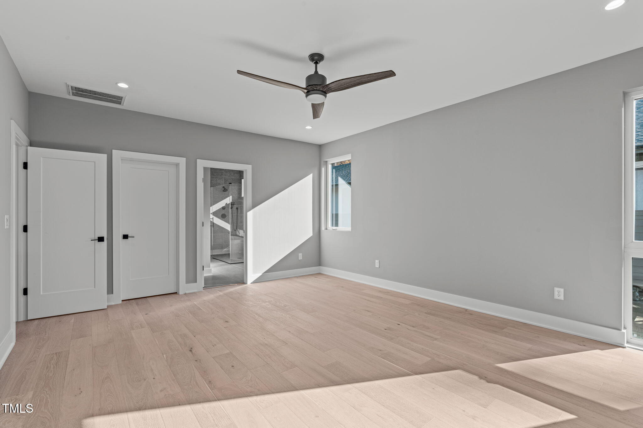 1439 Duplin Road Raleigh, NC 27607 - Photo 28 of 78 a view of empty room with wooden floor and fan