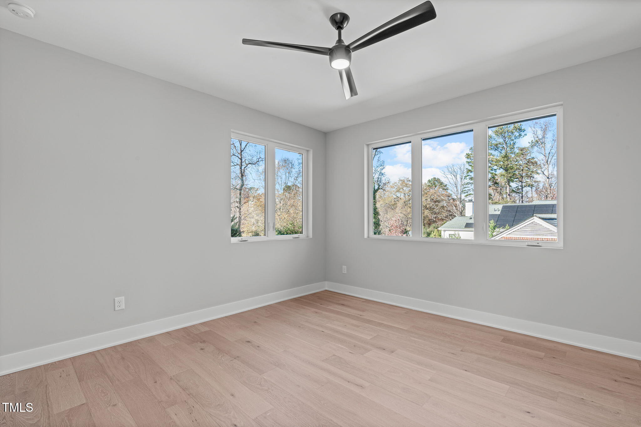 1439 Duplin Road Raleigh, NC 27607 - Photo 40 of 78 a view of empty room with window and ceiling fan