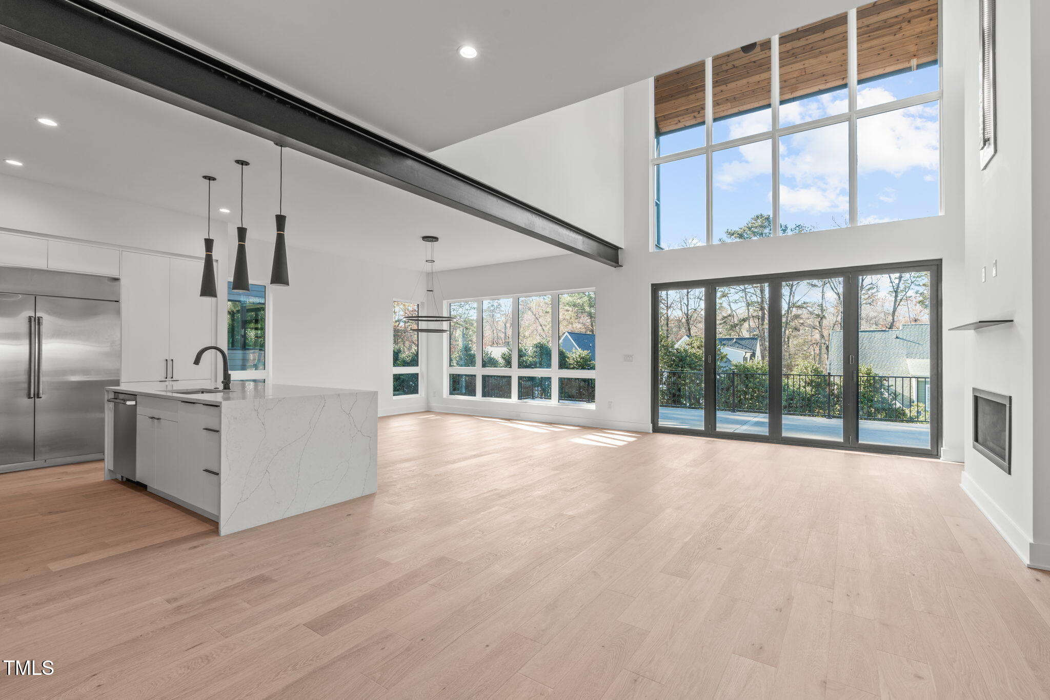 1439 Duplin Road Raleigh, NC 27607 - Photo 4 of 78 a view of an empty room with wooden floor and a window