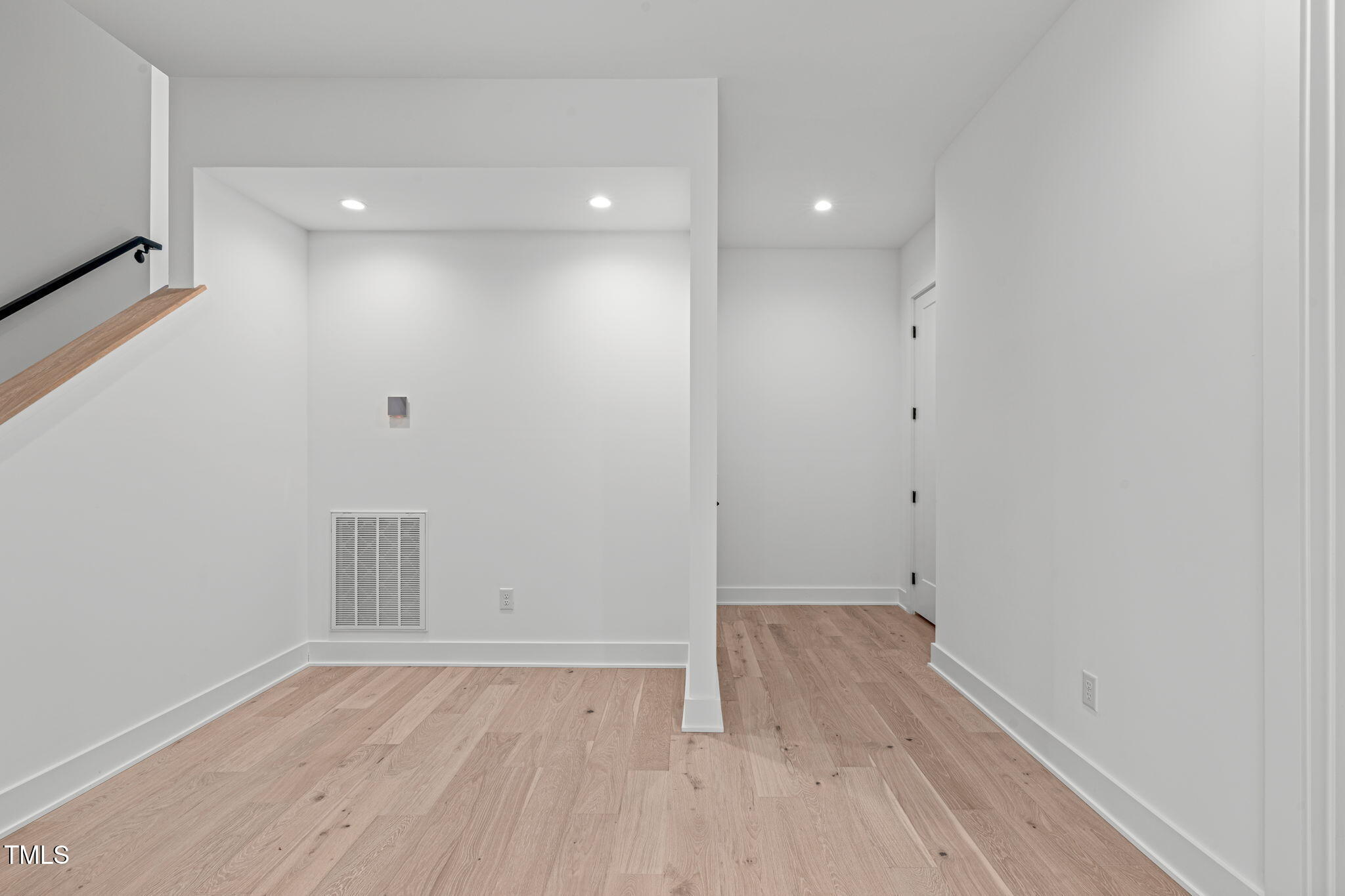 1439 Duplin Road Raleigh, NC 27607 - Photo 49 of 78 a view of a room with wooden floor and white walls